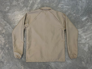 CHAMARRA COACH BEIGE CON BROCHE