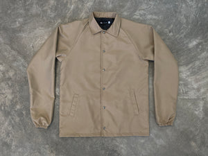 CHAMARRA COACH BEIGE CON BROCHE
